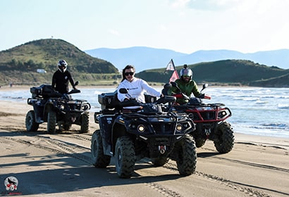 three people in atv in Vlore Albania