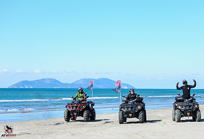 three people in atv in Vlore Albania
