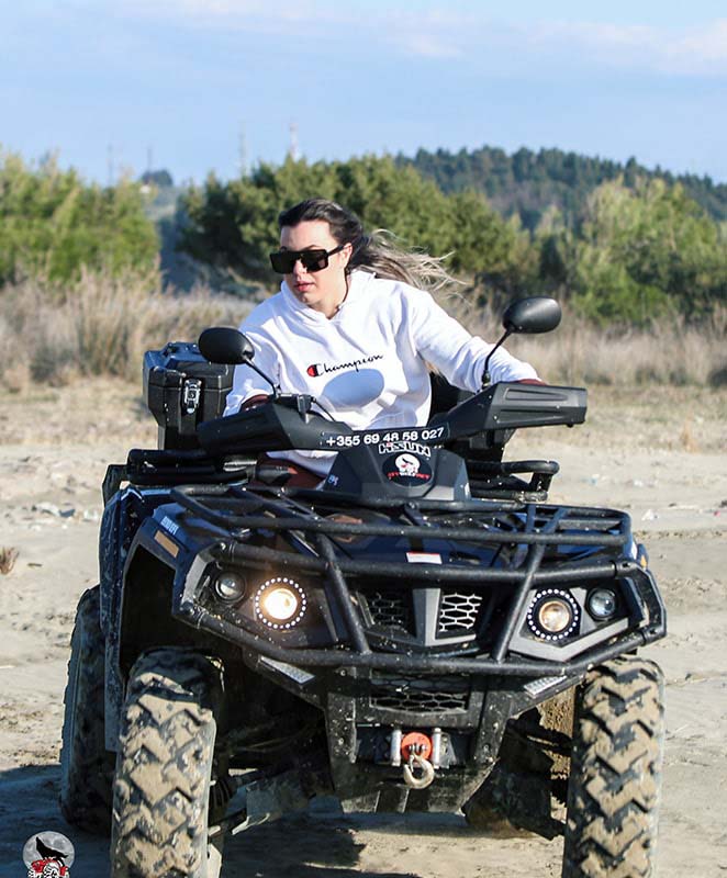 a girl riding an atv off road vehicle in Vlore, Albania